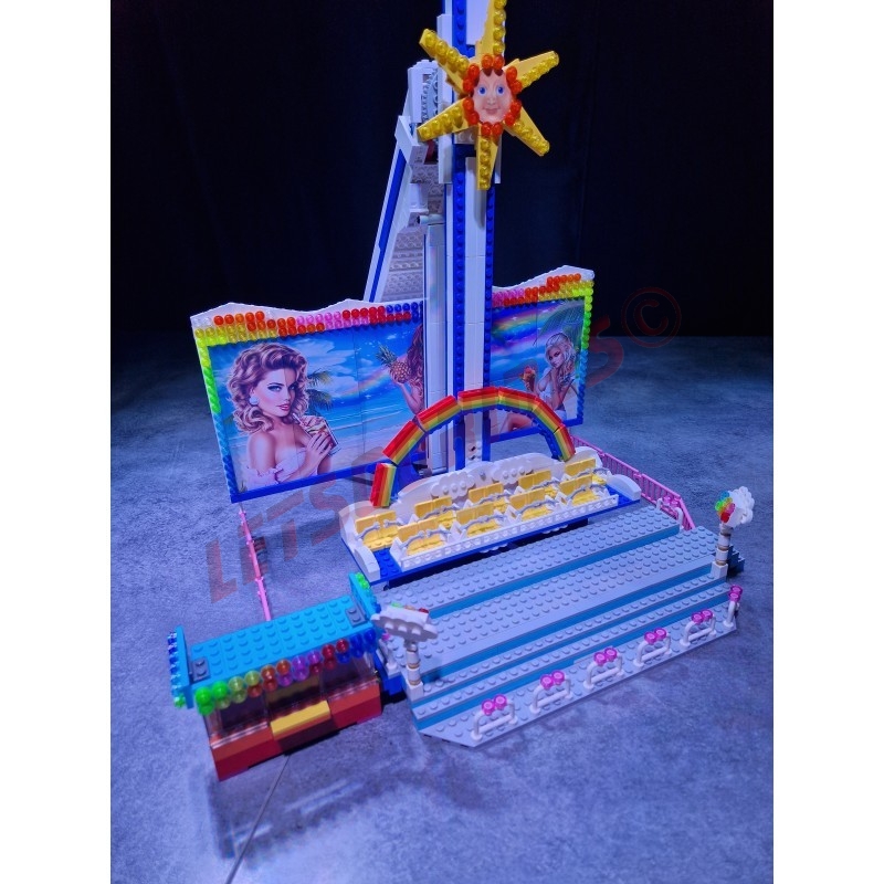 LetsGoRides - Rainbow, 
Motorized reproduction of the fairground attraction "Rainbow" made with Lego bricks. Transportable on 3
