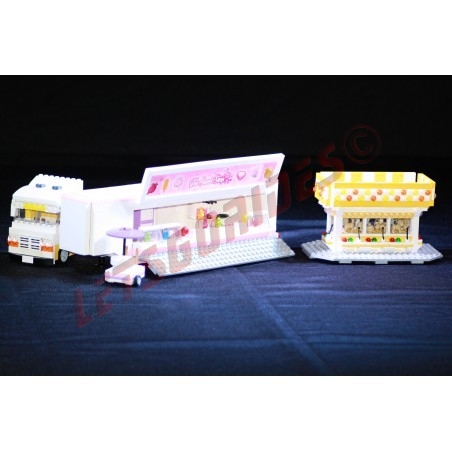 LetsGoRides - Candy Store, 
Reproduction of the fairground attraction "Candy shop" in Lego bricks. Transportable on a trailer.